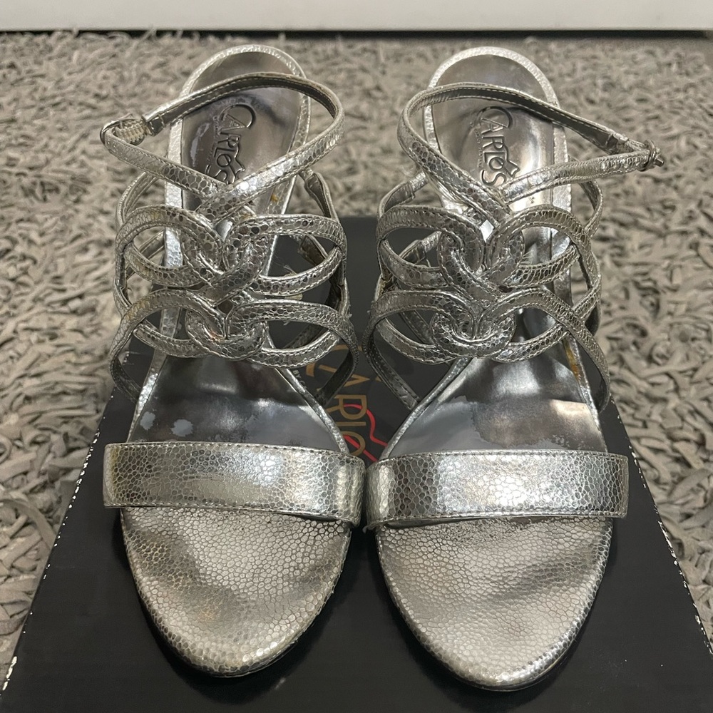 Carlos Santana, necktie-silver strappy heels.